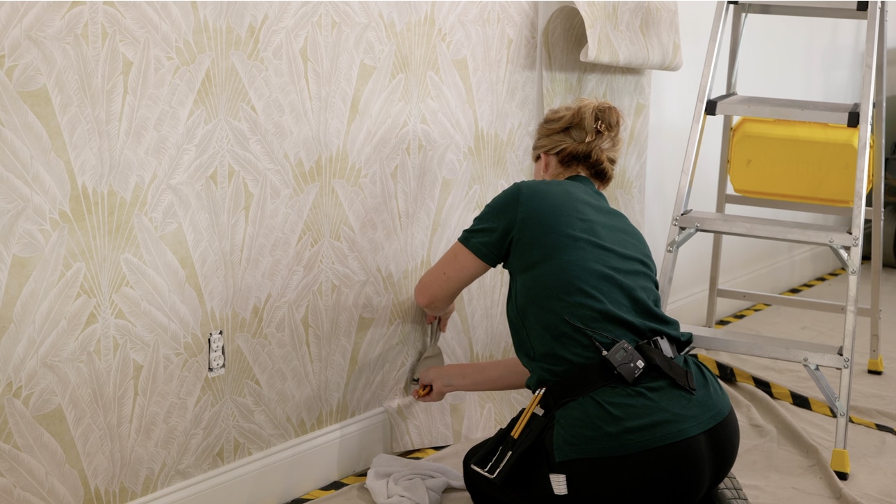 Close-up view of a wallpaper installation and finished wall surface